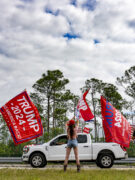 Photo shows supporters waving flags and cheering as hundreds of decorated cars and trucks with supporters of US President-elect Donald Trump participate in a Trump Victory Parade in West Palm Beach, Florida